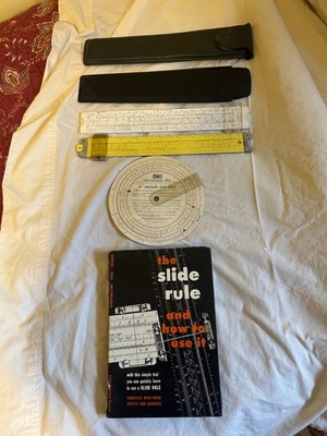 Three Slide Rules and a Book on how to use it by Sommers