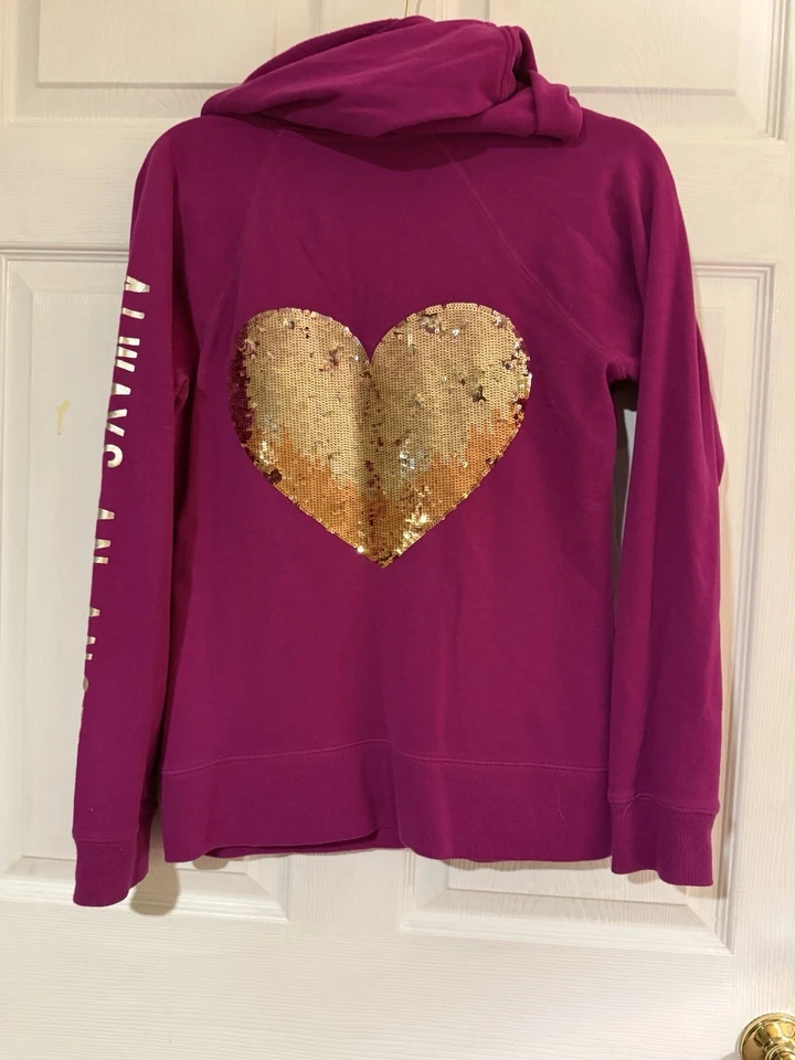 Sudadera con Capucha VS Angel Cremallera Color Frambuesa, Lentejuelas Doradas Talla M Usada en Excelente Condición Foto 2 de 4