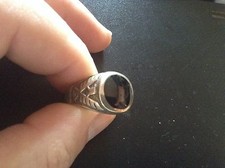 Sterling silver and black onyx round ring.