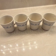 Set Of 4 Corning USA ceramic mugs featuring a blue floral vine or band pattern