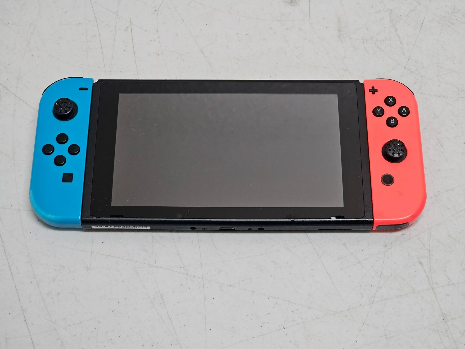 Nintendo Switch Console (model HAC-001) with Neon Blue  and Neon Red Joy-Cons