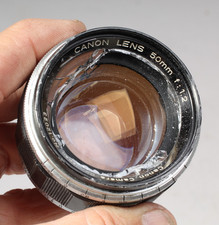 CANON 50MM F/1.2 M39 SCREW MOUNT W CAPS PARTS OR REPAIR BROKEN FRONT ELEMENT