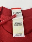 Red vintage Disneyland Mickey Mouse T-shirt with white tag reading “The Walt Disney Company Made in U.S.A.”