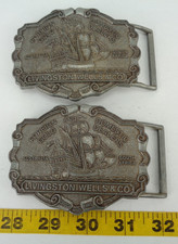 Lot of 2 Livingston Wells  Co Belt Buckle Foreign Gold Domestic Dealers Ship