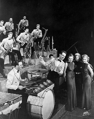 Band leader Fred Waring directs orchestra as Lane Sisters sing 1934 Old Photo