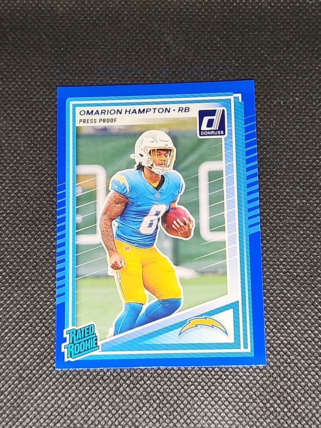 2025 Panini Donruss - Rated Rookie Omarion Hampton #303 Press Proof Blue (RC)