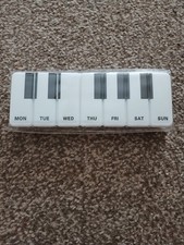 Large piano style daily pill box