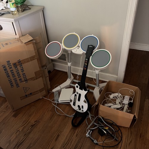 Nintendo Wii console with Rock Band bundle Has 1 Game Sports