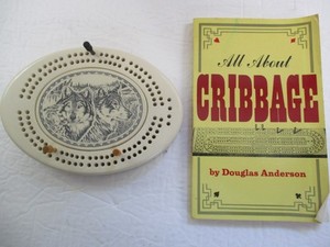 North Coast Trading Oval Cribbage Board Faux Ivory Wolf  Scrimshaw & Book