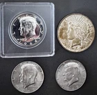 1923 Peace Dollar 1964 & 1968 Kennedy Half Dollars.  Four Silver Coin Lot