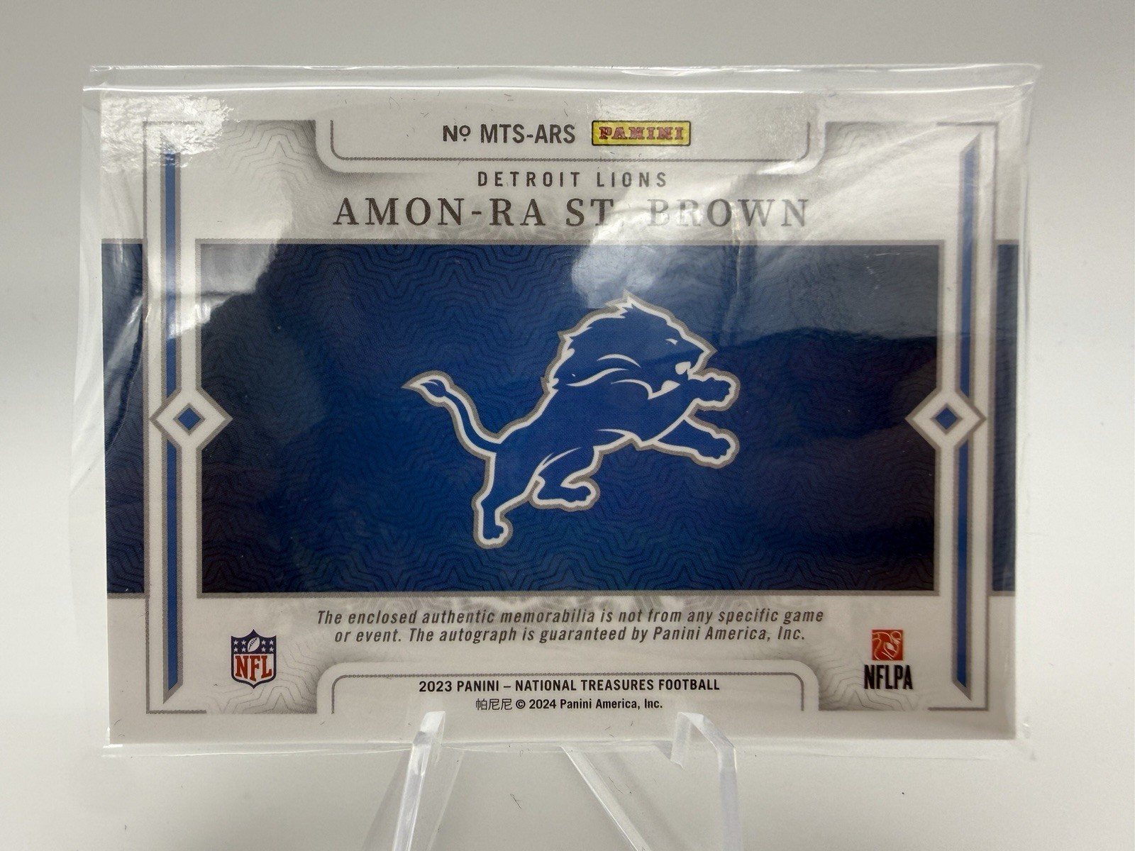 2023 National Treasures Amon-Ra St. Brown Material Treasures NFL Shield Auto 1/1 view 2