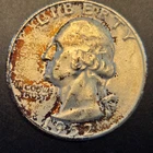 1952s Washington silver quarter.Low mint.Heavy mineral toning