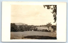 Postcard View from Hill across Field and Open Water RPPC F197
