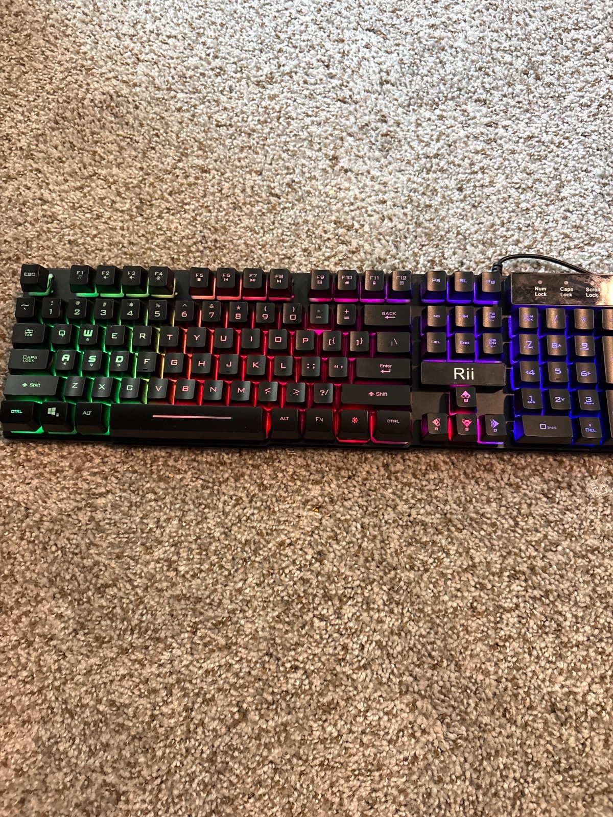 rii wired keyboard and is black with RGB colors. cleaned and