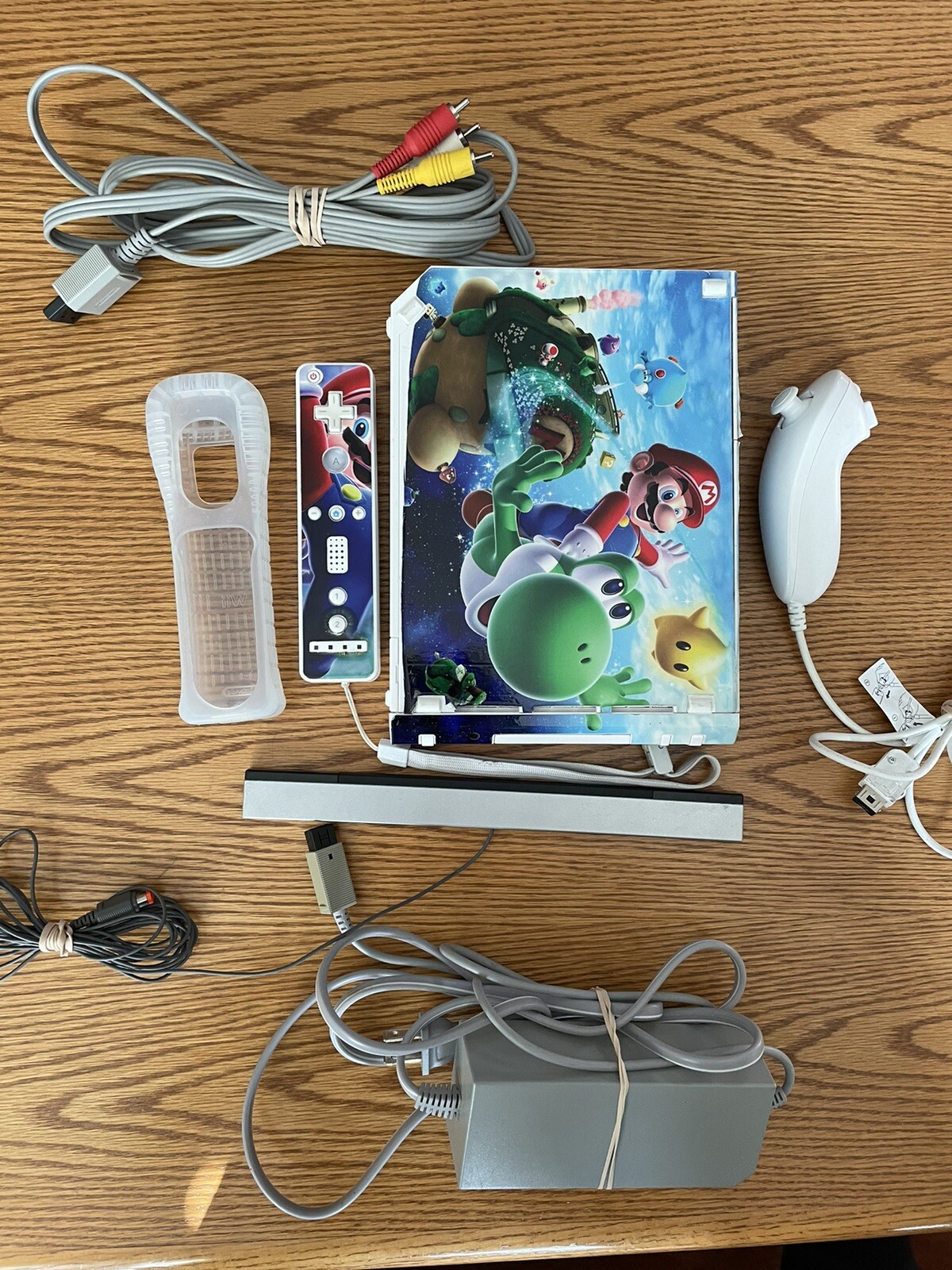 Nintendo Wii Console with Mario Galaxy Decals, Motion Plus Remote, and Nunchuck Included