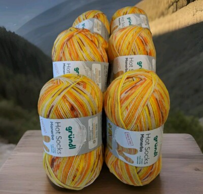 Sockenwolle Gründl Manerba 6×100g (6×420m) 39,00  Gelb-orange meliert