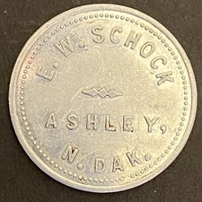 E.W. Schock Ashley, ND N. Dak. Dry Goods Alum G/F 25¢ Trade Token c1922-39 26mm