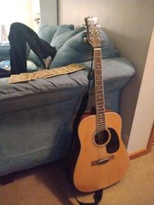 Acoustic Guitar With Strap And  Extra Strings 