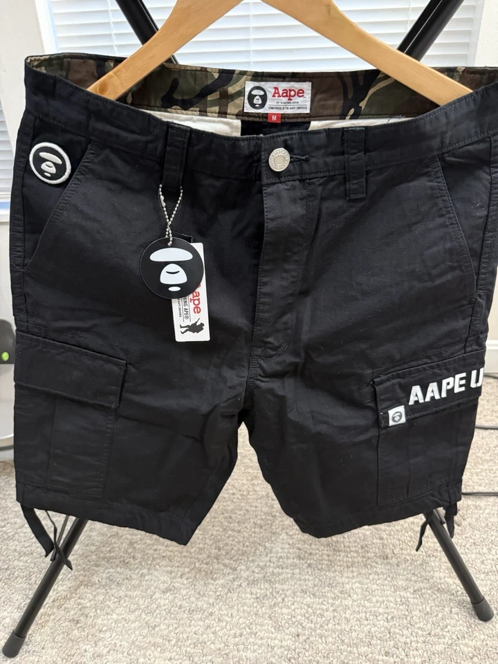 Bermuda Aape By *A BATHING APE preta com estampa de logotipo solta exército carga masculina tamanho médio  - Imagem 2 de 4