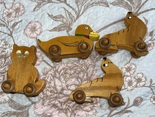 Lot Of 4 PRIMATIVE VINTAGE WOODEN  Animal ON  WHEELS CHRISTMAS ORNAMENTE TOY