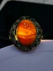 Sterling silver ring with a brown gradient banded Sulemani agate, translucent.