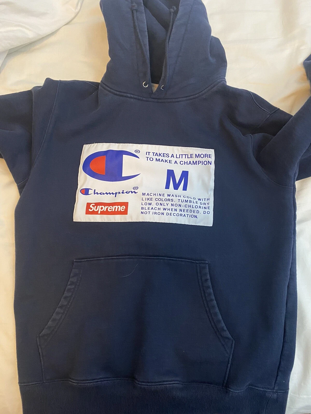 Sweat à capuche étiquette Supreme x Champion bleu marine moyen