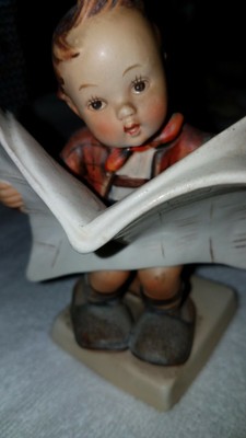 hummel boy reading newspaper