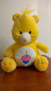 yellow care bear with cupcake