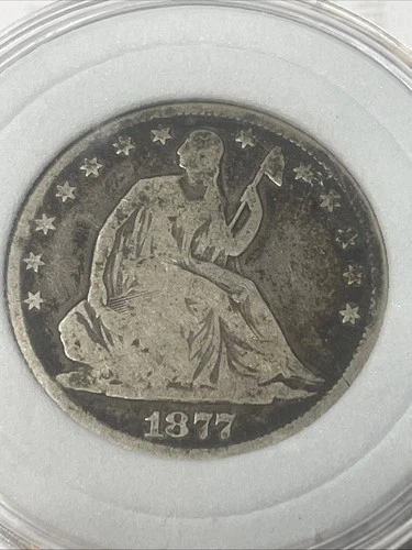 1877 SEATED LIBERTY SILVER HALF DOLLAR VERY GOOD COIN.
