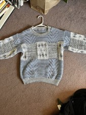 Vintage blue and white knit sweater with textured panels. No tag