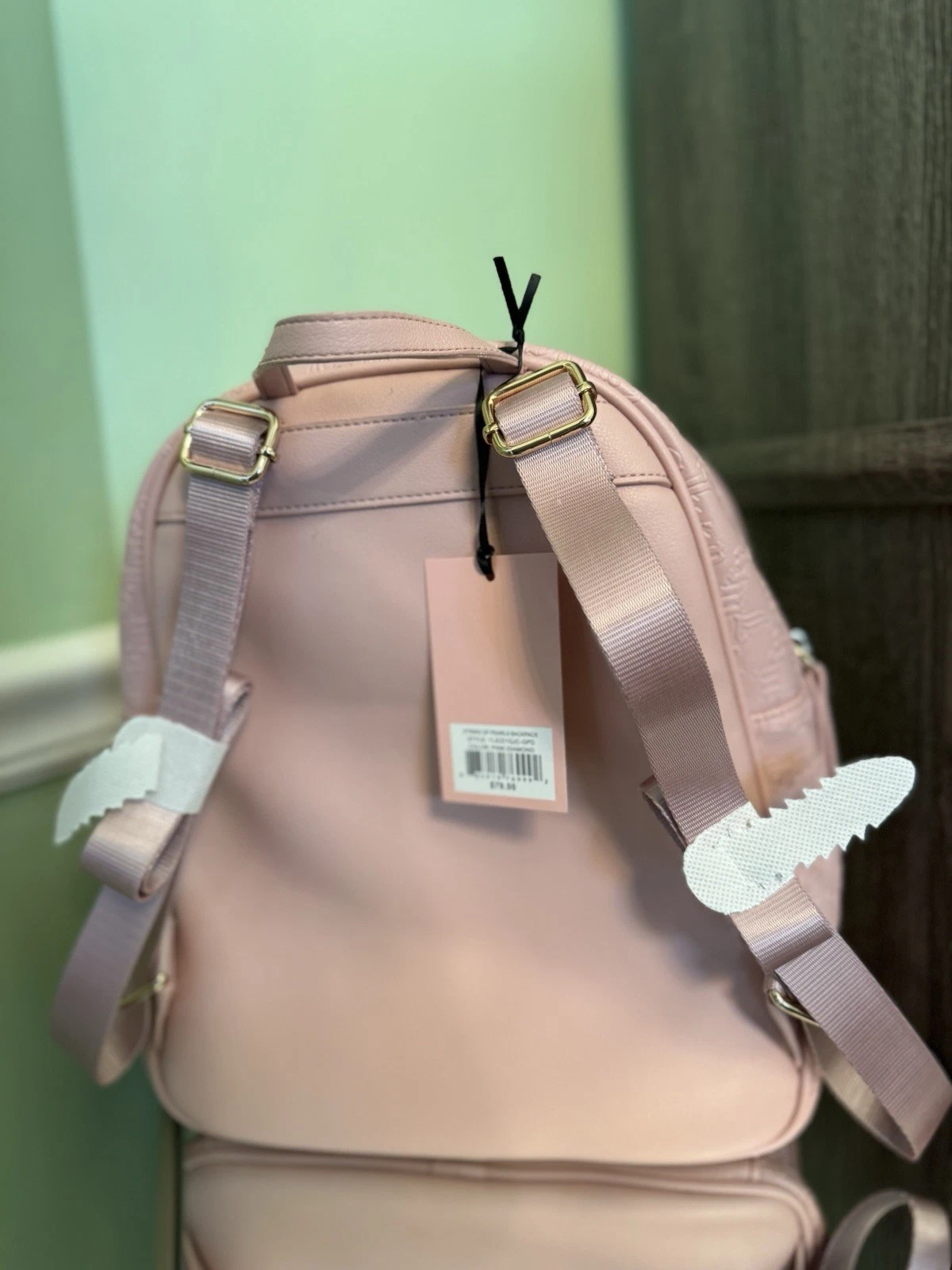 Zaino Juicy Couture rosa nuovo con etichetta con dettagli in perle e piccolo portamonete.