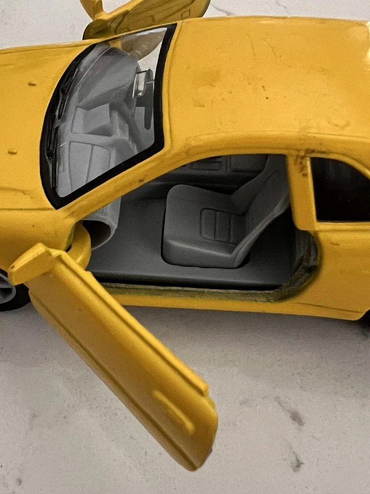 Nissan Skyline GTR R34 Kinsmart escala 1:36 Foto 3 de 4