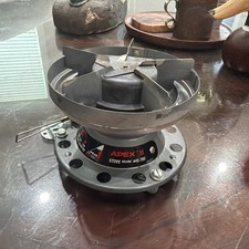 Apex II stove model 445-700 with pots and lid.