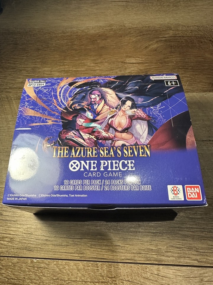 One Piece OP14 Booster Box – The Azure Sea's Seven, 24 Sachets Anglais + Promo Baruzcard, édition Limitée