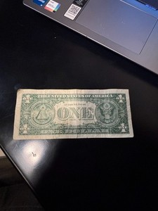(2) 1957 blue seal dollar bills