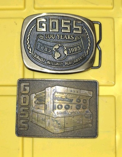 Two Goss Corporation Belt Buckles