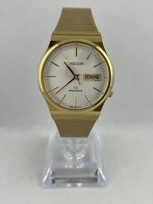Goldene NOS Vintage Herrenarmbanduhr Ricoh Quartz Day & Date, funktioniert