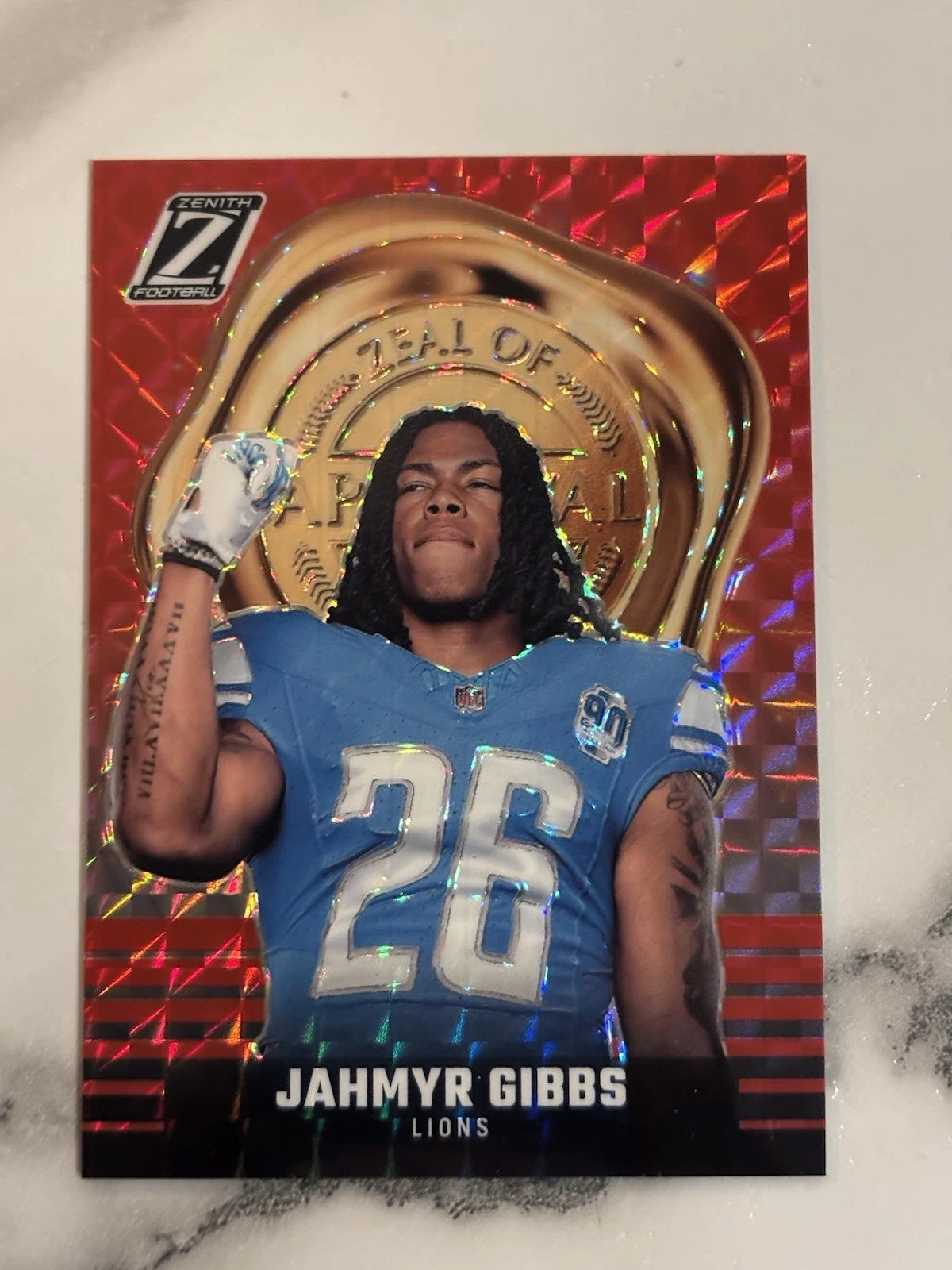 2023 Panini Zenith Jahmyr Gibbs Red Mosaic Prizm Zeal Of Approval RC, Lions 🏈🏈