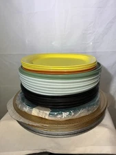 A set of  Tupperwear plates and other manufacturers About 35 Pcs