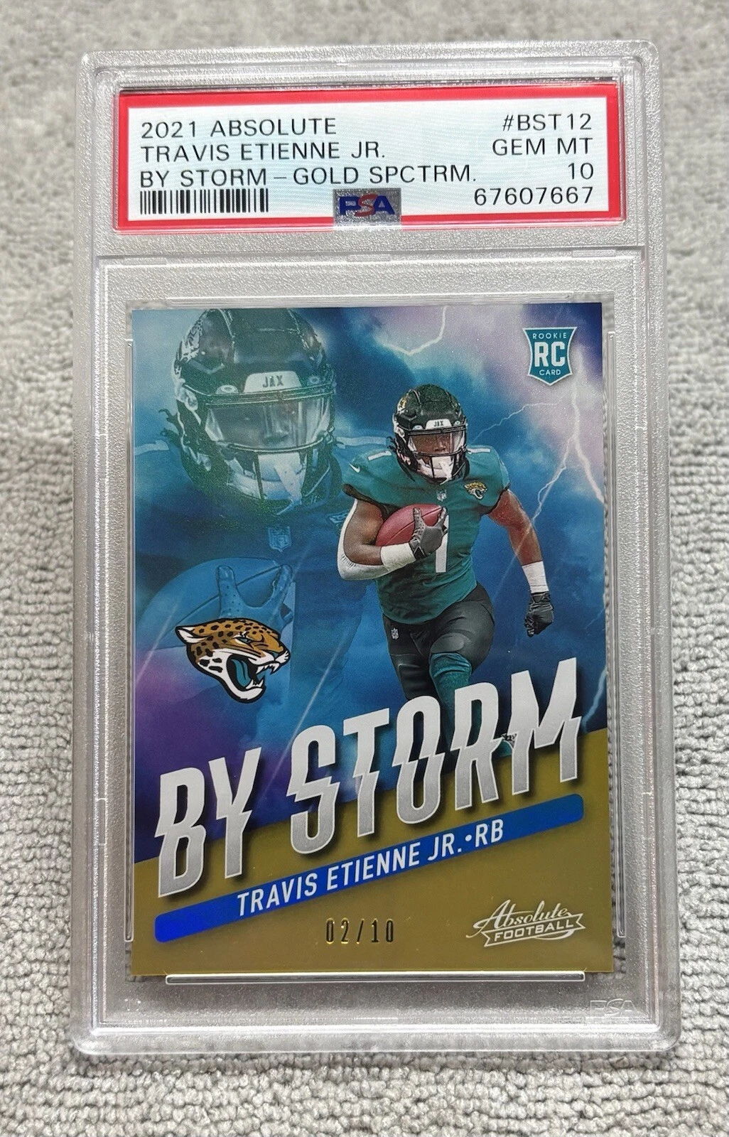 Travis Etienne Panini Absolute By Storm #BST12 Gold Spectrum