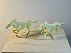 Lot of 2 Marx 1950's original 54mm plastic galloping horses as shown.