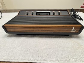 Atari 2600 4 Switch Woodgrain with 4 Controllers Untested No Power Cord