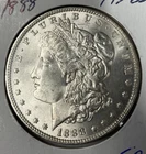 (A) 1888 SILVER BU MORGAN DOLLAR 1$