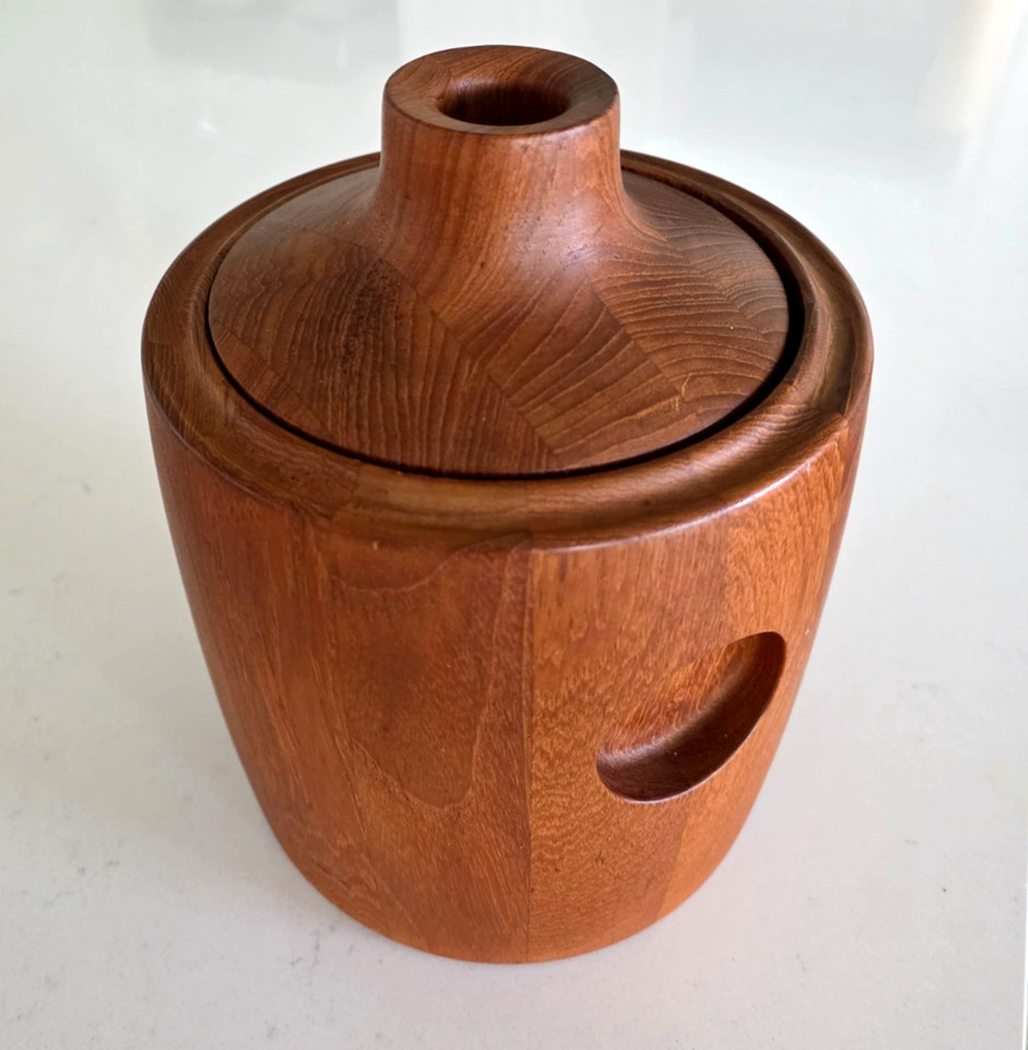 A teak ice bucket designed by legendary Danish silversmith Henning Koppel for Georg Jensen — this is museum-quality Scandinavian design you can actually use.