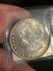 1887 $1 Morgan Silver Dollar in UNC+ Condition Toning