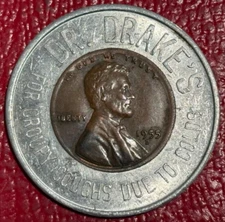 ENCASED COIN XF/AU  1955 D LINCOLN CENT DR. DRAKE'S COUGH SYRUP.-JUN424