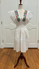 One of a Kind Mexican Hand loom embroidered dress, with ruffle sleeve.