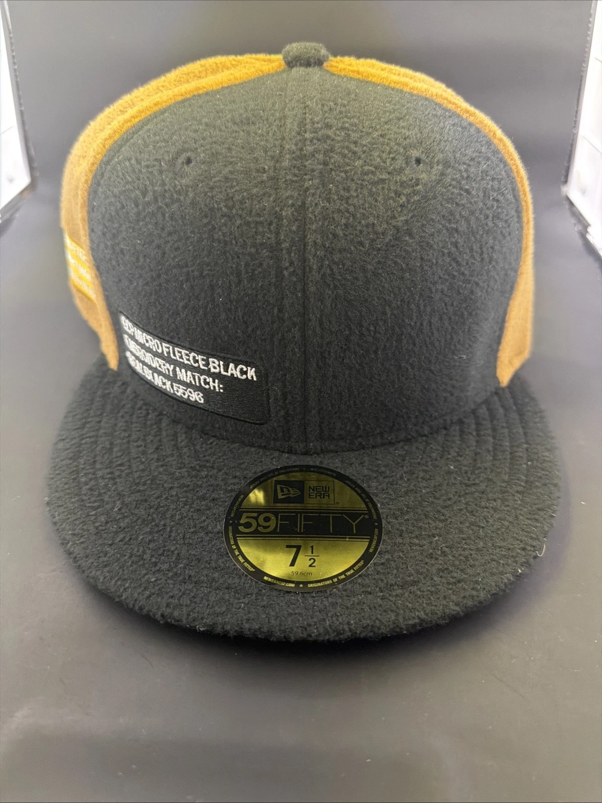 59Fifty New Era Cap Micro Fleece Black Bronze Demo Hat New Size 7 1/2 Rare
