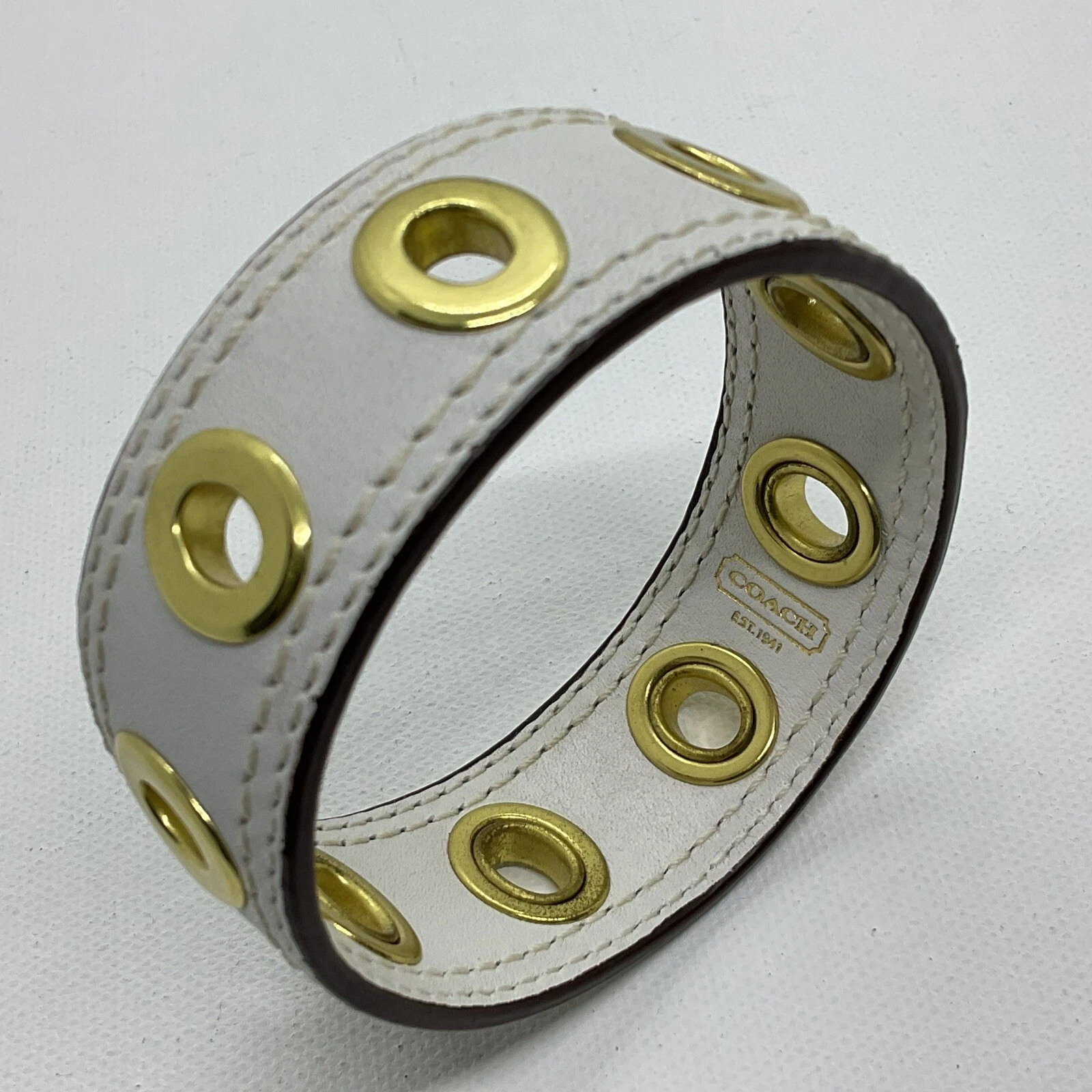 Autentico Braccialetto Largo Coach in Pelle Bianca Tono Oro