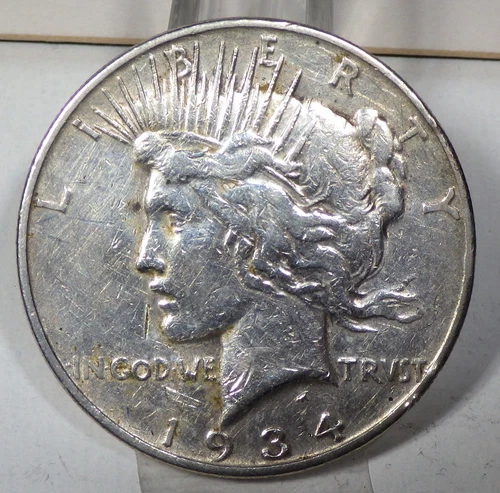 1934-D Peace Silver $1 VF Details cleaned; Jan.8th Silver$74.16, $1 Value $57.79